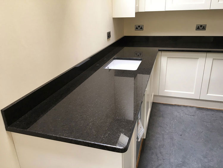 Black galaxy vs black pearl granite countertops