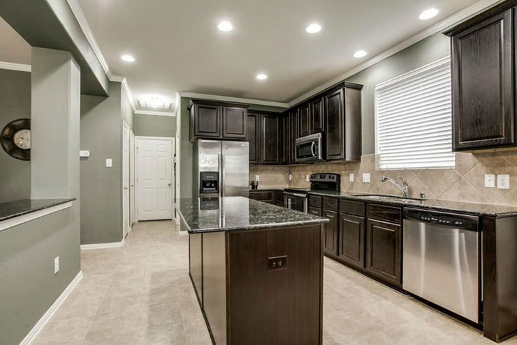 Black kitchen cabinets with black pearl granite countertops