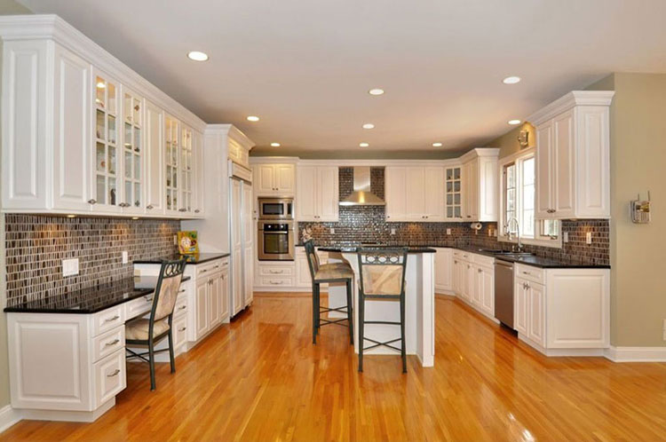 Black pearl countertops with tile backsplash