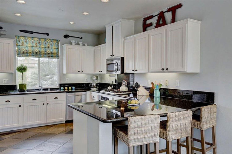 Black pearl granite countertops with white cabinets