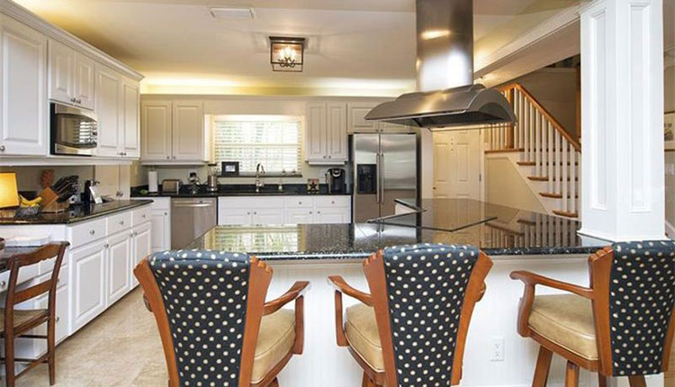 black pearl countertops with white cabinets